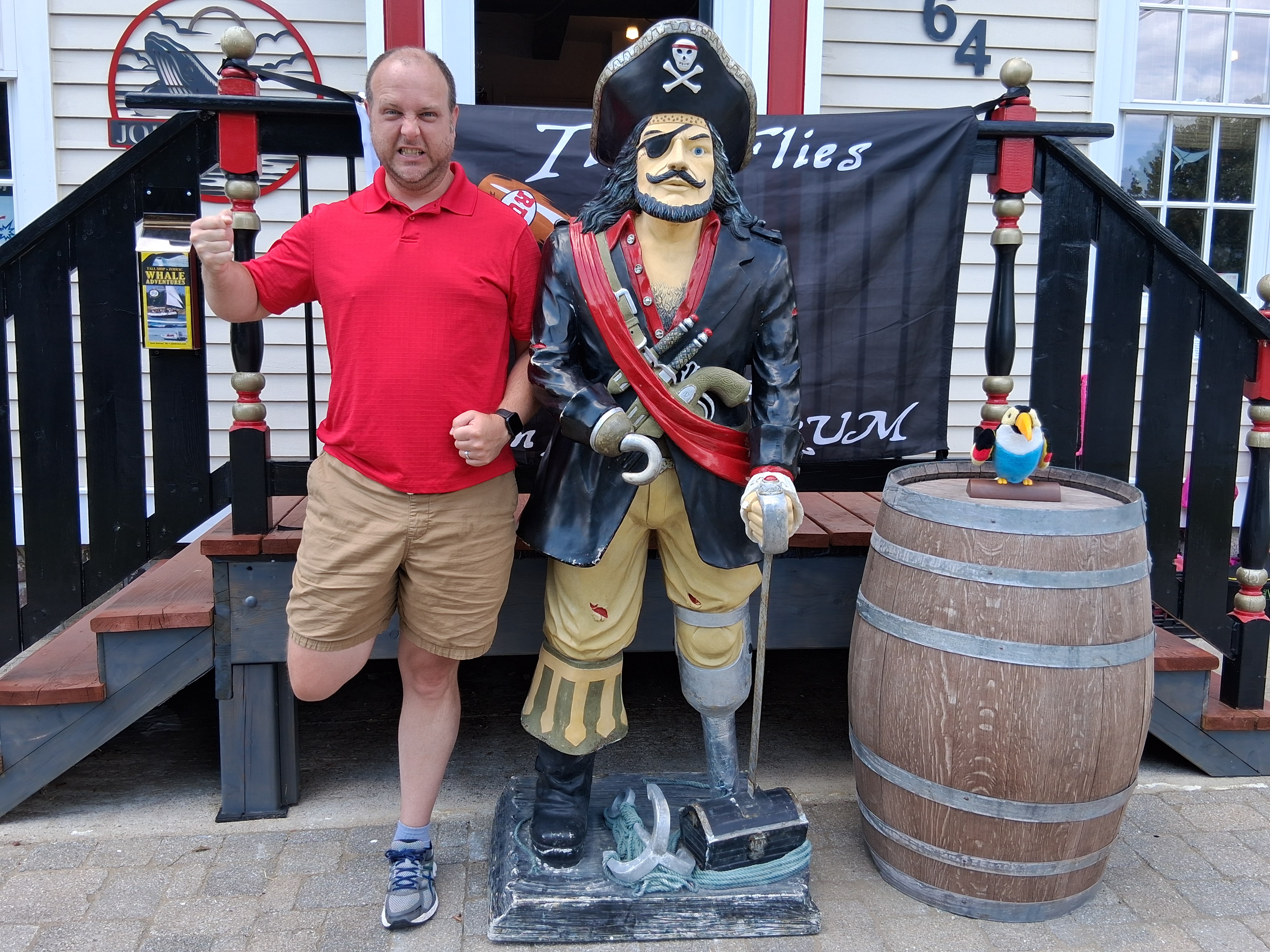 The original photo of Kevin standing next to a pirate statue
